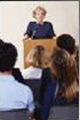 A teacher at a lectern