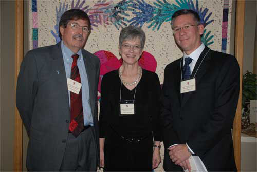 Mary Lawrence, president and CEO of Cornucopia House Cancer Support Center greets the honorary co-chairs of the 10th annual A Chocolate Affaire. Co-chairing were Dr. H. Shelton Earp, director of the UNC Lineberger Comprehensive Cancer Center (left), and Dr. H. Kim Lyerly, director of Duke Comprehensive Cancer Center.