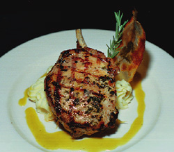 Grilled center-cut pork chop with  garlic mashed potatos.