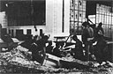 Hickam Field personnel man this gun emplacement set up in a bomb crater