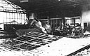 A severely damaged P-36 sits in the rubble of Hangar 1 at Wheeler