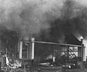 the roar of flames in Hangar 3 was punctuated by firecracker-like explosions from the great quantity of ammunition stored there