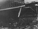 view of blazing fires in the twisted remains of Hangar 3 at Wheeler Field