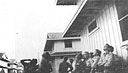 Members of the Hawaiian Air Force's Headquarters Squadron, 17th Tow Target Squadron, and 23d Materiel Squadron watch Japanese high-level horizontal bombers heading toward Pearl Harbor