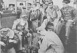 Image: BOMBARDIER TRAINING; ENLISTED MEN PREPARE FOR BOMB-SPOTTING FLIGHT