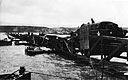 An Army DUKW Crosses One of the British-Built WHALE Barges at OMAHA Beach