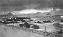 Building an Airfield in the Aleutians -- Seabees lay pierced plank on a runway under flood lights