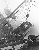 Photo # 80-G-54505:  Hoisting out landing craft from USS Heywood, during the Attu invasion, May 1943