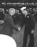 Photo # 80-G-701139:  Hospital Apprentice First Class Robert E. Bush receives the Medal of Honor from President Harry S. Truman, 5 October 1945