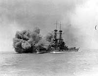 Photo # NH 60569:  USS Delaware firing her main battery guns during battle practice, 26 June 1920