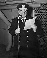 Photo # NH 67226:  Capt. Paul L. Mather takes command of USS Ancon, Sept. 1942.