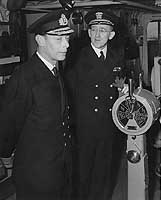 Photo # NH 67227:  King George VI visits USS Ancon, May 1944.