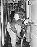 Photo # NH 103400: Fire drill on board USNS General Maurice Rose.  Photographed by Robert J. Parolini