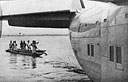 A native canoe meets the Clipper at Leopoldville