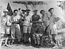 Brigadier D. H. Pienaar <i>(seated)</i> with some of his officers (l. to r.): Major H. Mill Colman (1st Field Company, S.A.E.C.), Major S. B. Gwillam (No. 3 S.A. Armoured Car Company), Lieut.-Colonel G. T. Senescall (The Dukes), Major F. I. Gerrard (Brigade Major, 1st S.A. Infantry Brigade), Captain L. S. Steyn (No. 3 S.A. Armoured Car Company), and Lieut.-Colonel E. P. Hartshorn (1st Transvaal Scottish).