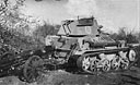 A tank of No. 1 S.A. Light Tank Company takes a captured gun in tow after the highly successful raid on El Wak. <i>(Photo:</i> Terence McNally.)
