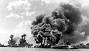 U.S. BATTLESHIPS HIT AT PEARL HARBOR. Left to right: West Virginia,
Tennessee, and Arizona (top); the West Virginia aflame (bottom).