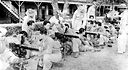 MORTAR SQUAD ASSEMBLING AN 81-MM. MORTAR M1 during training in the
Philippine Islands in 1941 (top). New recruits are given instruction in use of the
Browning .30-caliber machine gun M1917A1 (bottom). In 1936 a program for
national defense was initiated in the Philippine Islands. A military mission of U.S.
officers was charged with the organization and training of Filipino regular troops. In
July 1941 the Philippine Army was ordered into the service of the Army of the United
States and U.S. troops were sent to the islands from the United States.