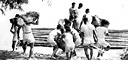 LOADING A BAMBOO RAFT before crossing a river during maneuvers (top),
troops and mules preparing to swim a river (bottom). By December 1941 U.S.
ground forces in the Philippines numbered about 110,000, of which a little over
10,000 were U.S. personnel. The remainder were Philippine scouts, constabulary,
and Philippine Army troops. As in the Hawaiian garrison, the hastily
mobilized army lacked training and modern equipment.