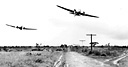 MEDIUM BOMBERS, B-18'S (top) and pursuit planes, P-36's (bottom) of the
U.S. Far East Army Air Force attack infantry troops during 1941 maneuvers in
the Philippines. When the Japanese attacked the Philippine Islands the United
States had some 300 aircraft in the Far East Air Force, but of these only 125
were suitable for combat. The 300 planes represented over 10 percent of the total
U.S. air strength at this time. The pilots and crews were well trained and lacked
only combat experience.