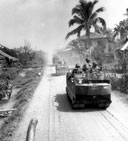 AMERICAN MOTOR CONVOY moving through the streets of a town on Leyte