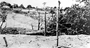 TANK OBSTACLES AND BARBED WIRE strung to delay the enemy advance
on Bataan (top); members of an antitank company in position on Bataan
(bottom). As the Japanese advanced, the defending forces withdrew toward the
Bataan Peninsula. The rugged terrain, protected flanks, and restricted 
maneuvering room on Bataan limited the enemy's ability to employ large numbers of
troops. Preparations for the defense of the peninsula were intensified and the
stocks of supplies were increased.