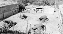 COASTAL DEFENSE GUN on Corregidor (top); 12-inch mortars on Corregidor
(bottom). Corregidor's armament comprised eight 12-inch guns, twelve 12-inch
mortars, two 10-inch guns, five 6-inch guns, twenty 155-mm. guns, and assorted 
guns of lesser caliber, including antiaircraft guns. The fixed gun emplacements 
were in open concrete pits and exposed to aerial attack and artillery
shelling. The Japanese kept up strong concentrations of fire against the defenses 
on Corregidor until most of the defending guns were knocked out.