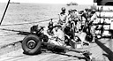 TROOPS EN ROUTE TO NEW CALEDONIA; in foreground is a 37-mm anti-tank
gun M3 (top). Men cleaning their weapons aboard a transport (bottom).
Some troops arrived in New Caledonia directly from the United States while
others went by way of Australia.