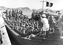 ARMY TROOPS ARRIVING AT the dock after leaving the transport.