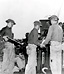 COAST ARTILLERY BATTERY training in Hawaii. Man at left is placing a round
in the manual fuze setter of a 3-inch antiaircraft gun M1917M2. A plan for the
defense of the Hawaiian Islands had been set up and joint maneuvers (land, air,
and naval forces) were held periodically to test the various security measures.