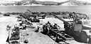 MEN OF AN ORDNANCE UNIT ASSEMBLING VEHICLES which had arrived
crated in sections. By October 1942 twenty-five men were completing six vehicles
a day on this assembly line.