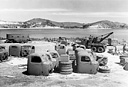 MEN OF AN ORDNANCE UNIT ASSEMBLING VEHICLES which had arrived
crated in sections. By October 1942 twenty-five men were completing six vehicles
a day on this assembly line.