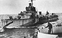 A U.S. COAST GUARD CONVOY CUTTER AND A DESTROYER MEET IN A RENDEZVOUS HELD SOMEWHERE AT SEA