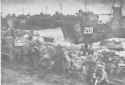 INVASION SUPPLIES ON BLACKENED SANDS OF IWO JIMA