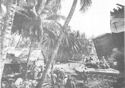 LST BEACHED IN THE MIDST OF A LITTLE FISHING VILLAGE ON CEBU