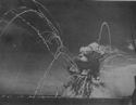 FIRE, STARTED BY BOMBS DROPPED AMIDSHIPS, SPREAD RAPIDLY TO THE SHIP'S MUNITIONS SUPPLY, WHICH EXPLODED TO FORM DANGEROUS THOUGH PICTURESQUE PATTERN ACROSS THE MEDITERRANEAN