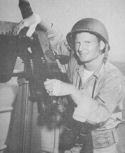 COAST GUARDSMAN MILTON SILER, SIGNALMAN FIRST CLASS, WAS STRUCK BY SHRAPNEL FROM GERMAN BOMBERS WHILE MANNING A MACHINE GUN ON THE SIGNAL BRIDGE OF A COAST GUARD-MANNED TRANSPORT PARTICIPATING IN THE INVASION OF SICILY