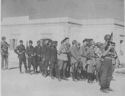 CAPTURED IN THE INVASION OF SICILY, A GROUP OF NAZI SOLDIERS OF THE AFRIKA KORPS, AWAIT TRANSFER TO A COAST GUARD MANNED ASSAULT TRANSPORT WHICH PARTICIPATED IN THE AMPHIBIOUS ATTACK