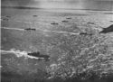 BATTLE-SCARRED BUT VICTORIOUS, A FLOTILLA OF COAST GUARD MANNED LCI(L)S REACHES HOME WATERS