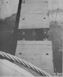 RAIL CARS ROLL INTO BOW OF COAST GUARD-MANNED LST