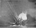 AN AMERICAN CARGO SHIP HIT BY NAZI DIVE BOMBERS DURING THE INVASION OF SICILY