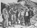INVADING AMERICAN COAST GUARDSMEN AND SOLDIERS MAKE FRIENDS WITH AN ITALIAN FAMILY NEAR THE BEACH AT PAESTUM