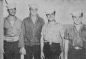 FOUR CREW MEMBERS OF A TANK LIGHTER ATTACHED TO A U.S. COAST GUARD-MANNED TRANSPORT