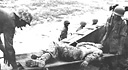 Casualty is hoisted aboard amtrac en route to hospital ship off Peleliu