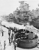 Fleet Landing Force personnel are transferred from USS Missouri to USS Iowa somewhere at sea