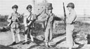 Chinese Nationalist sentries relive Marine bridge guards at Chinwangtao in October 1946