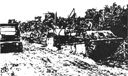 Figure 18. Maintenance in the field took place under difficult 
circumstances. The engine is being removed from the forward vehicle.