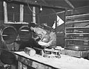 H. M. Garothorp, Bkr2c, bakes bread in ovens improvised from empty oil drums at Torokina PT bas