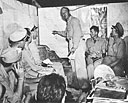 Comdr. Thomas G. Warfield briefs boat captains about to go on night patrol of the Bougainville coast in March 1944