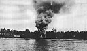 A Japanese storehouse on New Ireland, set ablaze by a landing party of PT personnel